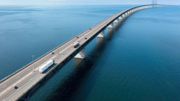 Trucks passing a bridge