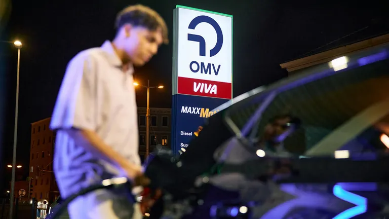 Man at OMV filling station at night